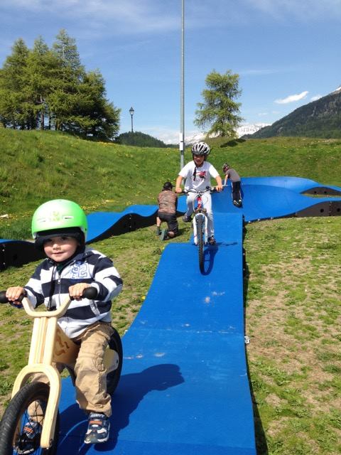 All ages, all abilities. Toddler rides a PARKITECT modular pumptrack.