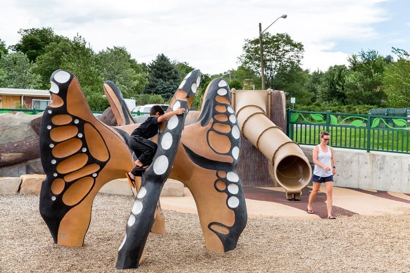 A child climbs a play structure at Discovery Park’s multigenerational playground in Wheat Ridge, Colorado