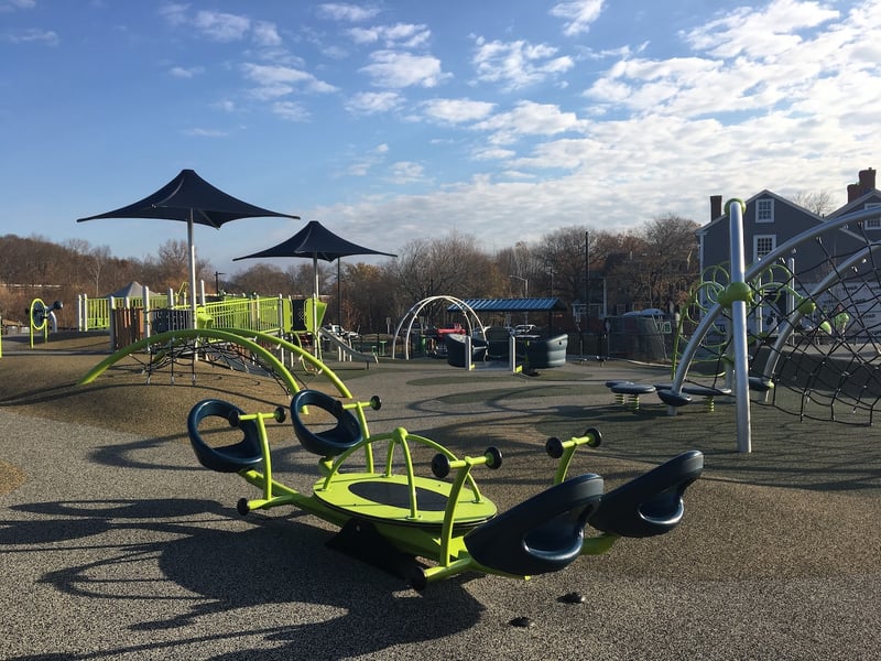 The equipment at a multigenerational and accessible playground in Coes Pond Park in Worchester, MA.