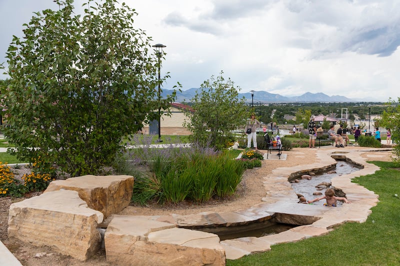 Children and adults alike can enjoy the water play area of Discovery Park’s multigenerational playground in Wheat Ridge, CO.