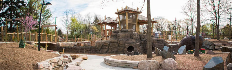 Bisons Bluff Park is a natural playground in Schaumburg, Illinois. The playground includes logs, boulders, sand, water and manufactured components that resemble natural elements.