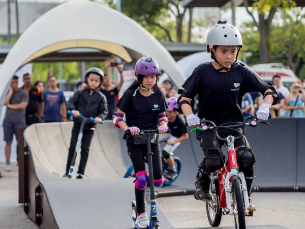 Children ride a modular pumptrack from PARKITECT