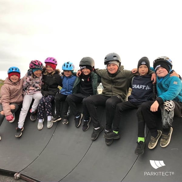 Kids smile sitting on PARKITECT modular pumptrack in Iceland