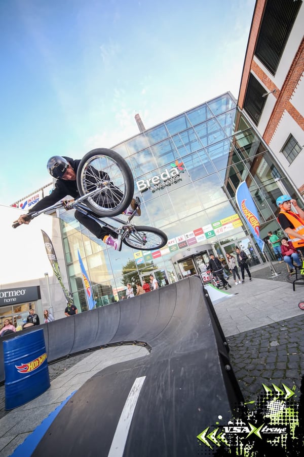 Modular play builds spacial awareness - a biker does a jump on one of our modular pumptracks