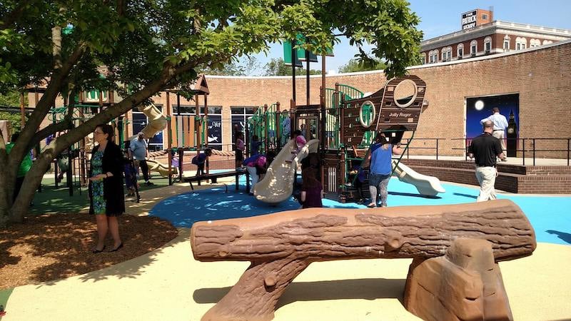 Never grow up. Children play on a themed playground based off of the children’s classic book Peter Pan in Elmwood Park, Roanoke, Virginia. The playground includes a ship, rope bridge, the Lost Boys' treehouse and treasure maps highlighting local amenities in Roanoke.