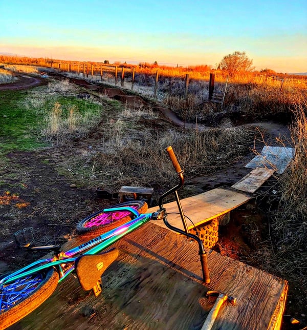 Not a bad view- sun sets over Kyle Cavins backyard pumptrack. Photo credit Kyle Cavin and the BackYard Pumptracks Facebook Group.