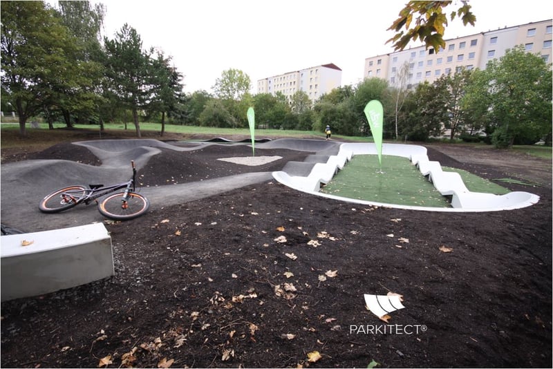 PARKITECT modular pumptrack made of precast concrete, incorporated in the landscape in 