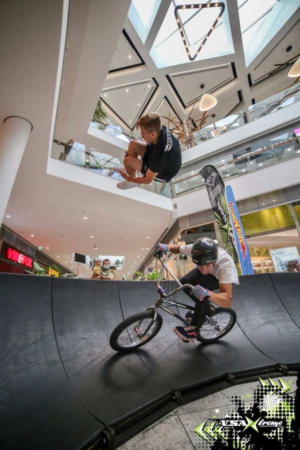 Two athletes fly on one of our modular pumptracks at an event sponsored by Hot Wheels and produced by VSA Xtreme.JPG