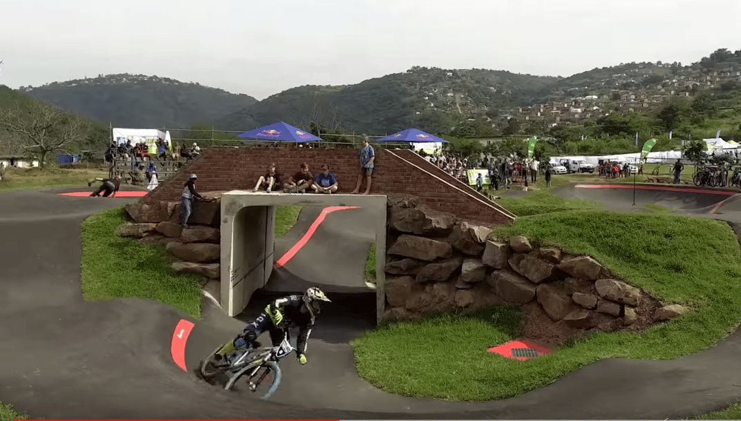 Pumptracks for your bucket list. The Velosolutions pumptrack in the township of Kwadabeka, Durban, South Africa features a bridge with a tunnel underneath it. Courtesy Velosolutions.