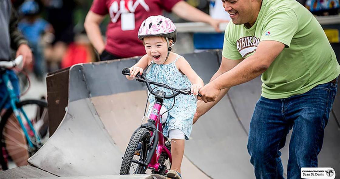 Young-happy-girl-riding-bike-on-a-pumptrack