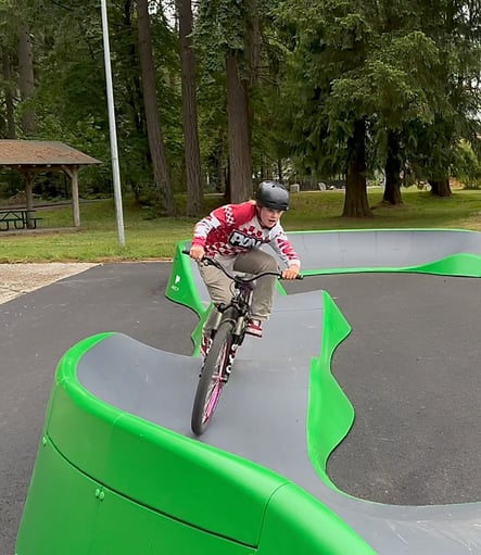 Young rider hits corners in style Tenino Pumptrack 